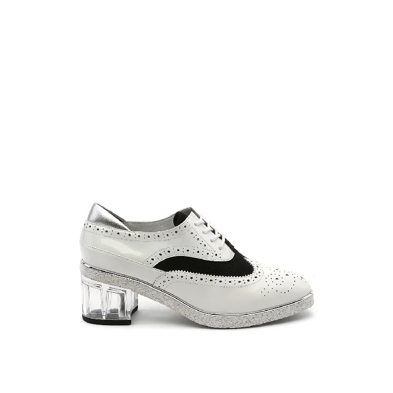 Women's patent leather stiletto heel pumps with a high - shine finishBrogue