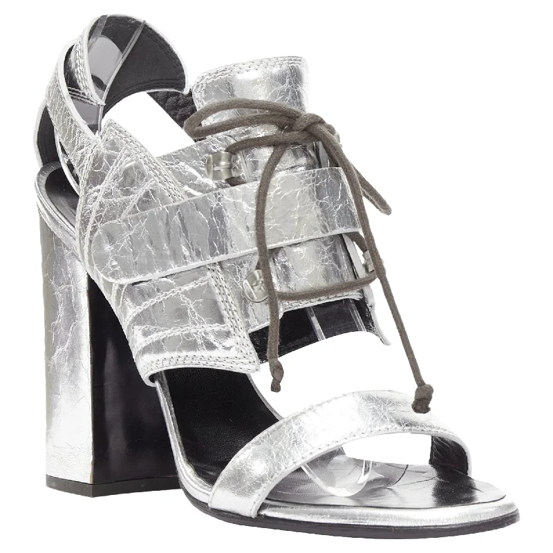 Women's metallic leather stiletto heel pumps with a reflective surfaceProenza Schouler crinkled metallic silver leather laced block heel sandal